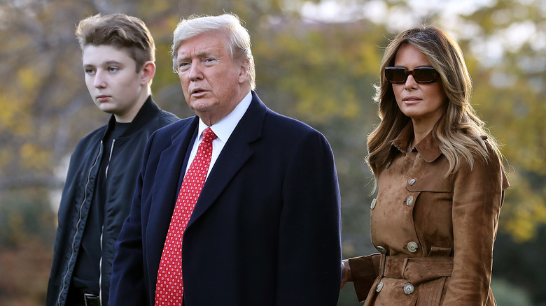 Barron, Donald, and Melania Trump walking