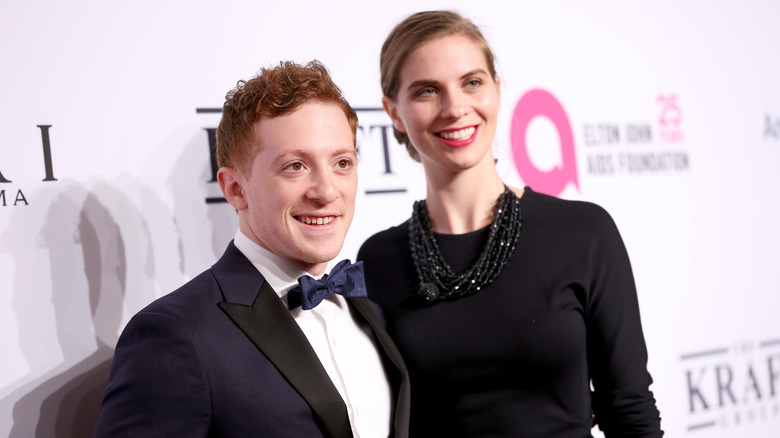 Lilly Jay and Ethan Slater posing at an Elton John AIDS Foundation event.