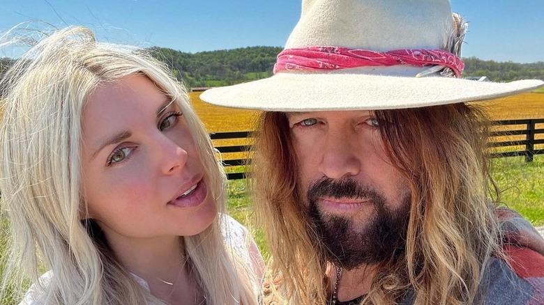 Billy Ray Cyrus and Firerose posing