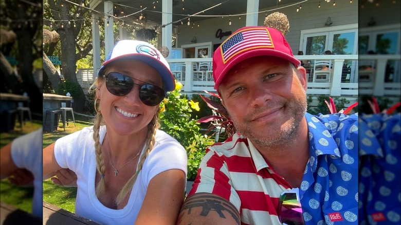 Jennifer Rauchet, Pete Hegseth posing for selfie while seated outside