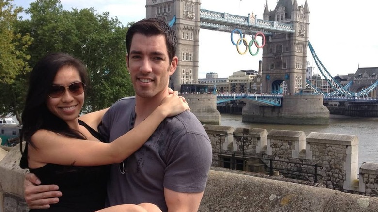 Drew Scott poses with Linda Phan in his arms in London