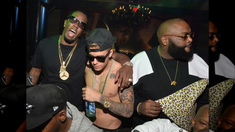 Diddy with arm around Justin Bieber