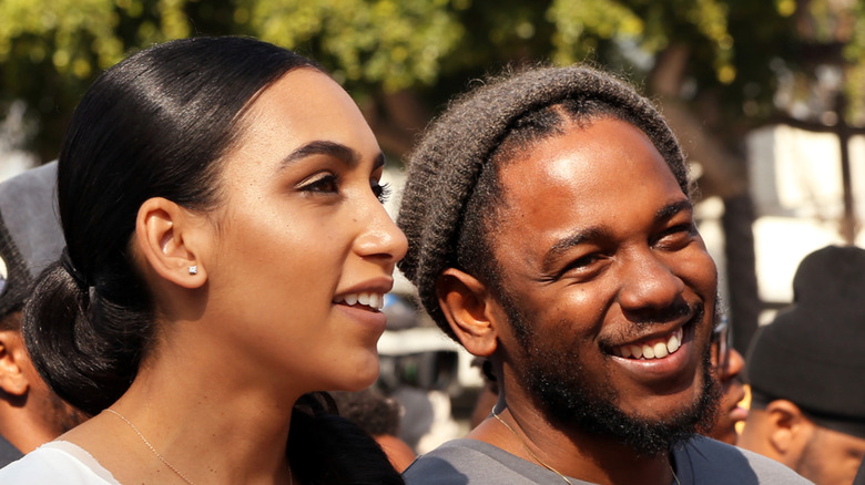 Kendrick Lamar and Whitney Alford, both smiling