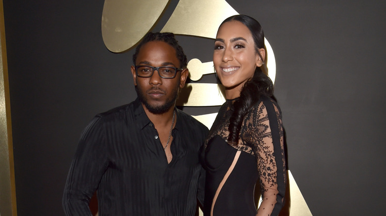 Kendrick Lamar and Whitney Alford, posing at an event