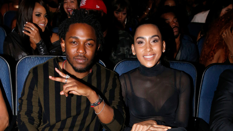 Kendrick Lamar, and Whitney Alford, posing at an event