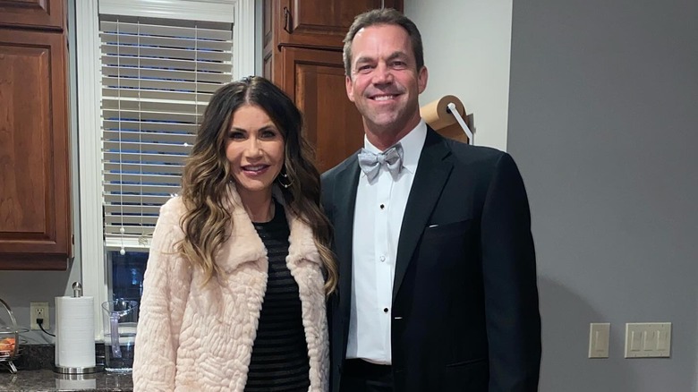 Kristi and Bryon Noem posing together in a kitchen