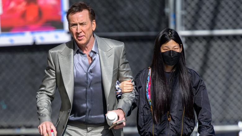 Nicolas Cage and Riko Shibata walking