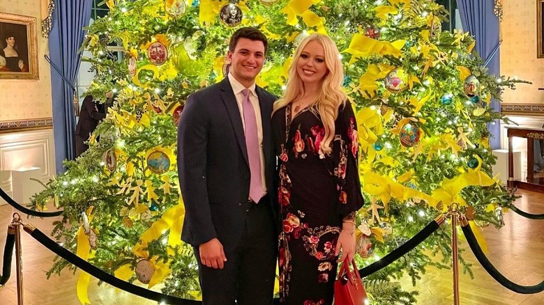 Tiffany Trump and Michael Boulos by Christmas tree