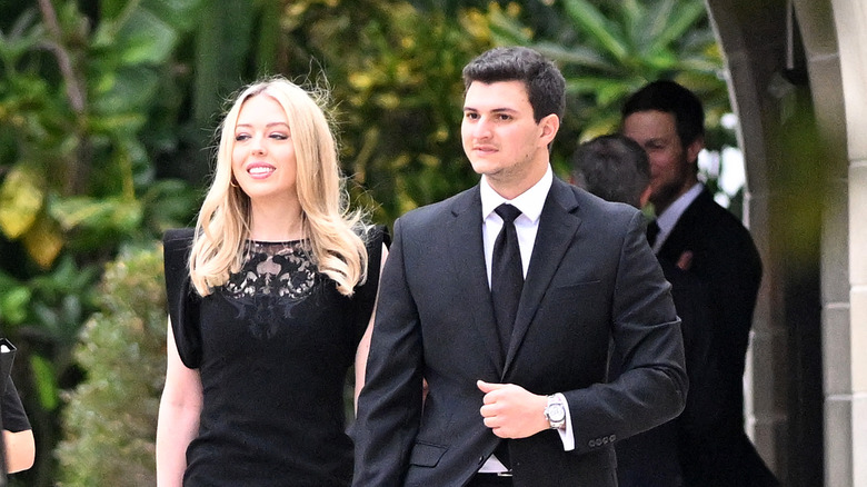 Tiffany Trump and Michael Boulos walk