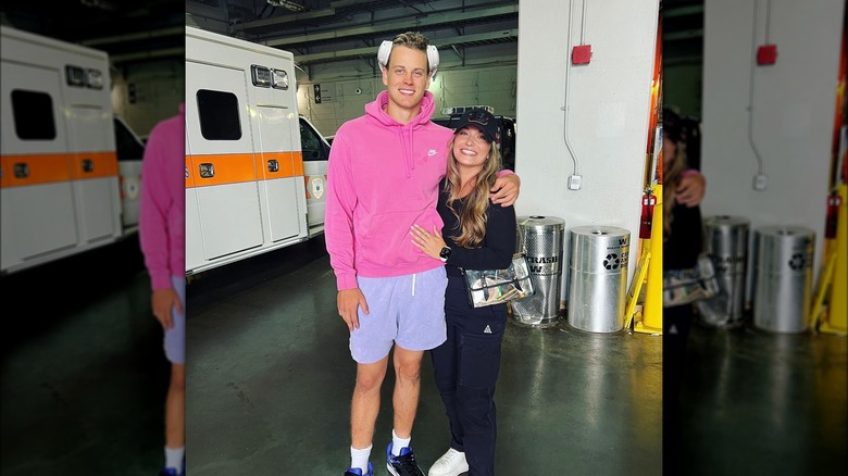 Joe Burrow and Olivia Holzmacher posing