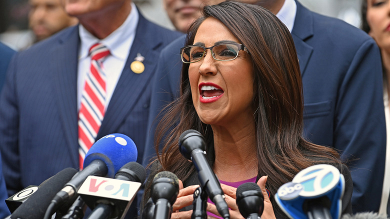 Lauren Boebert speaks into a microphone