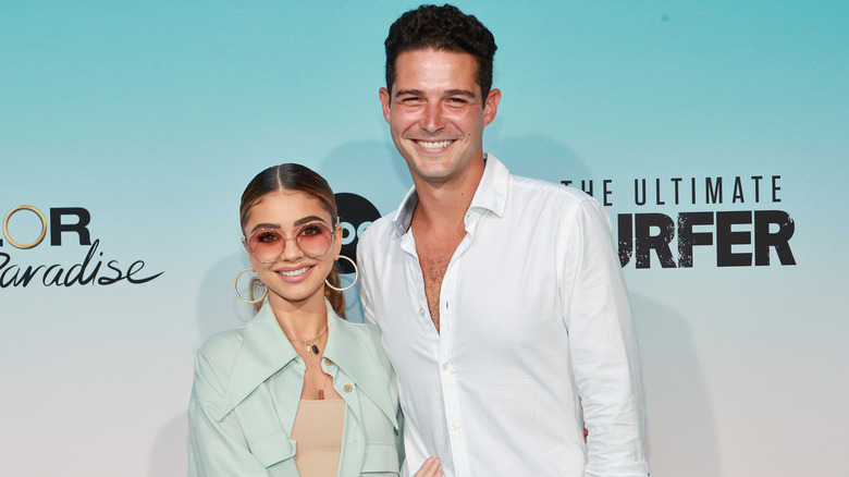 Wells Adams and Sarah Hyland posing