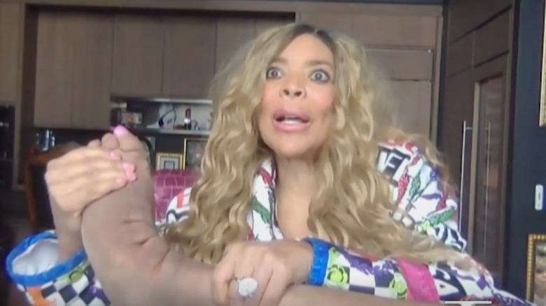 Wendy Williams holds up foot