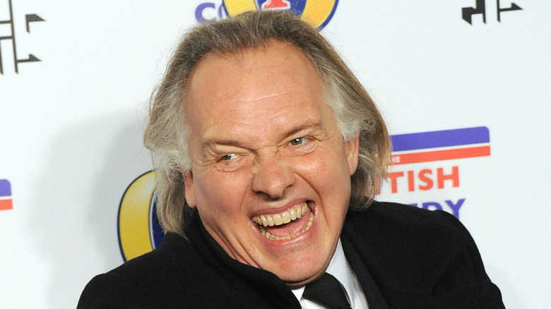 Rik Mayall laughing