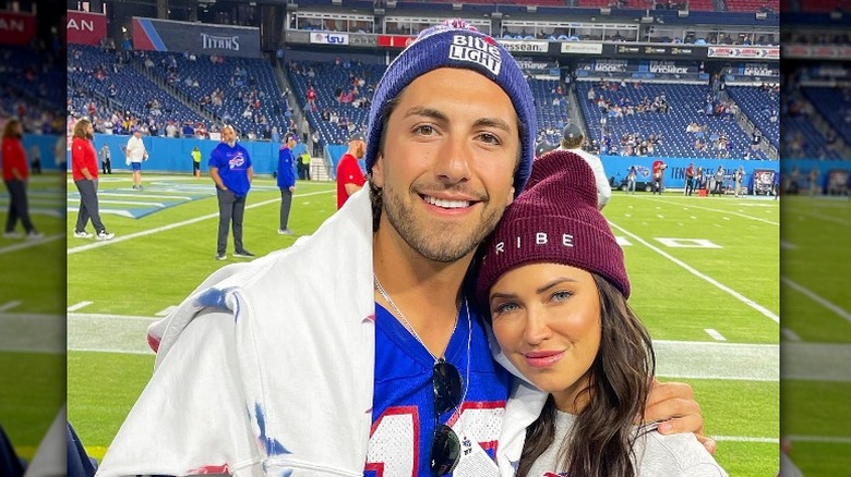 Jason Tartick and Kaitlyn Bristowe at a football game