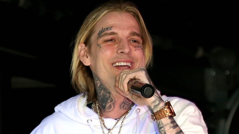 Aaron Carter performs live, showing Melanie tattoo