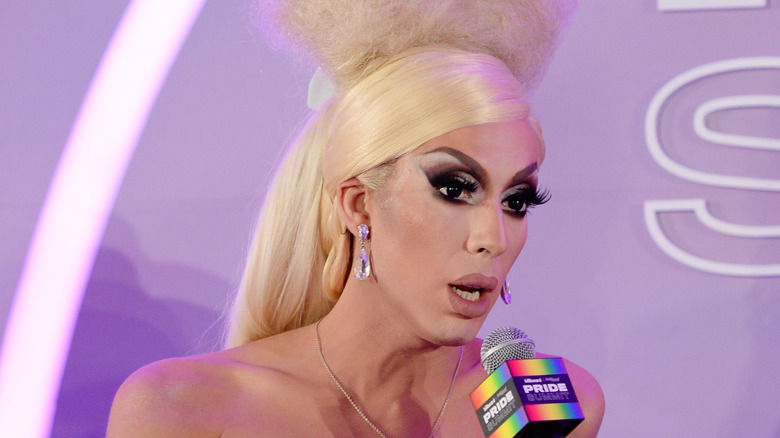 Alaska speaking into a microphone