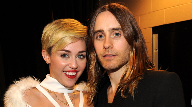 Miley Cyrus smiling with Jared Leto