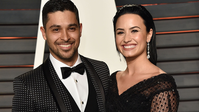 Wilmer Valderrama and Demi Lovato smiling 