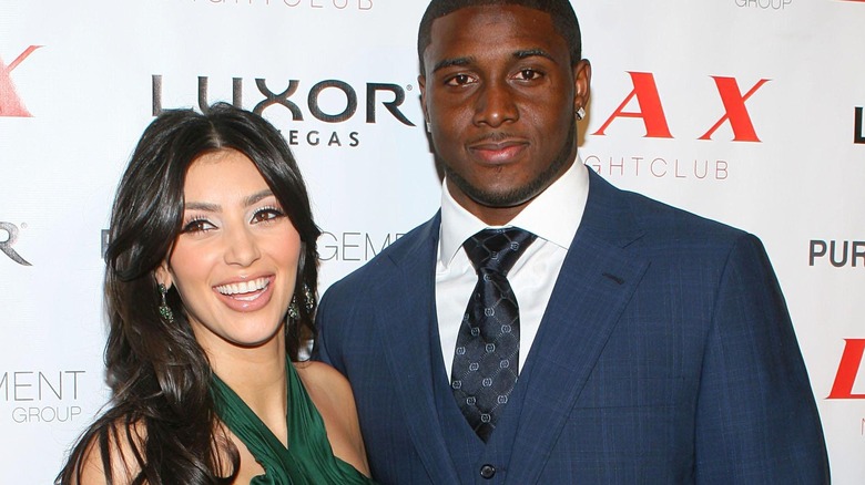 Reggie Bush and Kim Kardashian smiling  