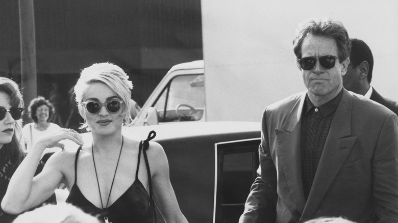 Madonna walks with Warren Beatty