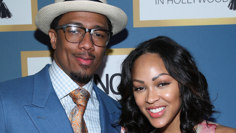 Meagan Good and Nick Cannon, both smiling