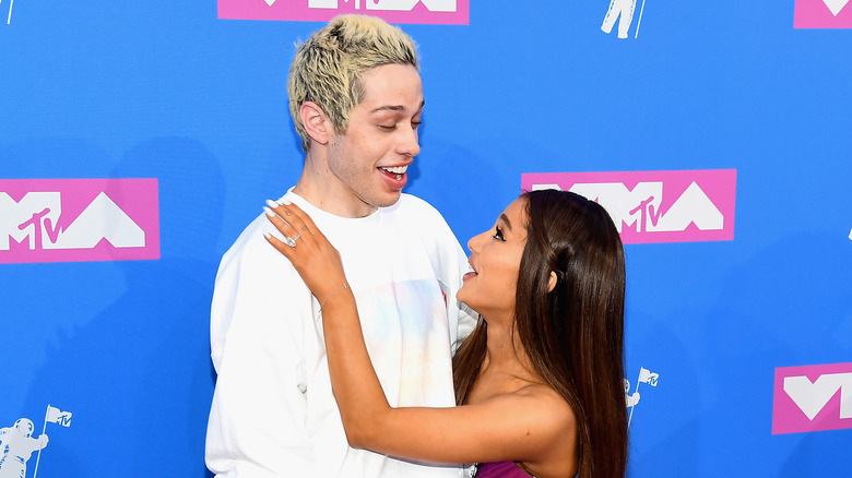 Ariana Grande looking up at Pete Davidson