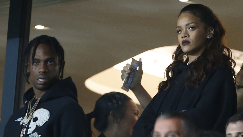 Travis Scott, Rihanna, at a game together 