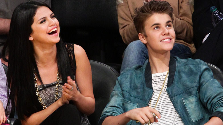 Selena Gomez and Justin Bieber sitting