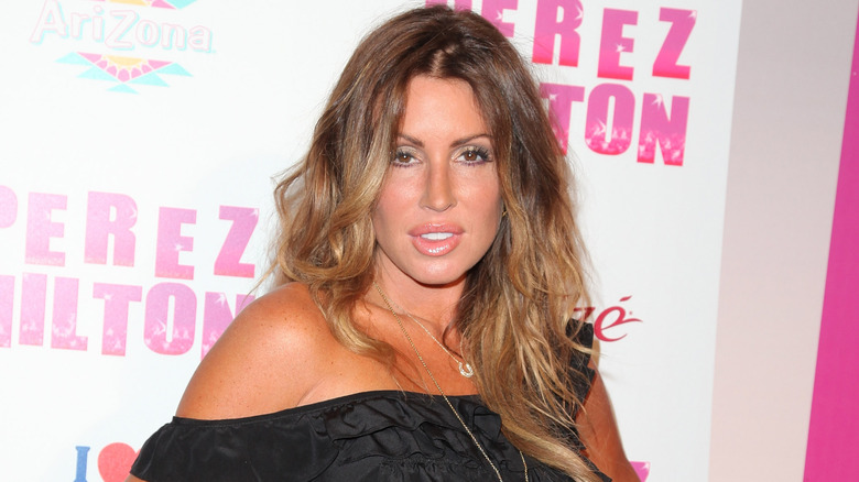 Rachel Uchitel, posing at an event