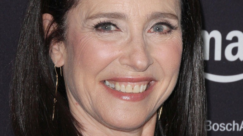 Mimi Rogers smiling