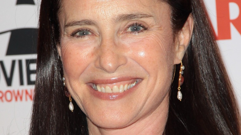 Mimi Rogers with a big smile