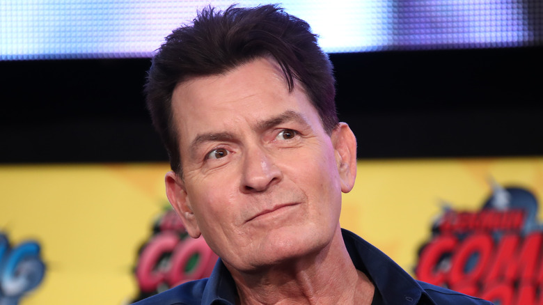 Charlie Sheen posing for cameras