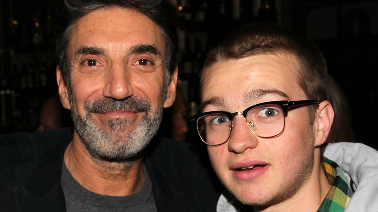 Chuck Lorre and Angus T. Jones posing