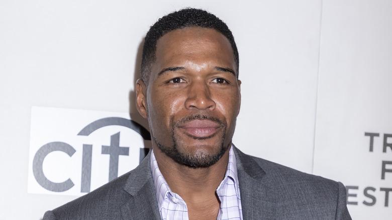 Michael Strahan with a serious expression