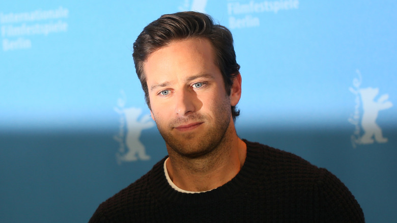 Armie Hammer at staring downward at the Final Portrait Photocall in 2017