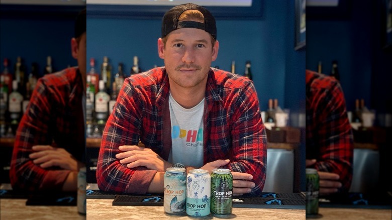 Austen Kroll posing with his beers