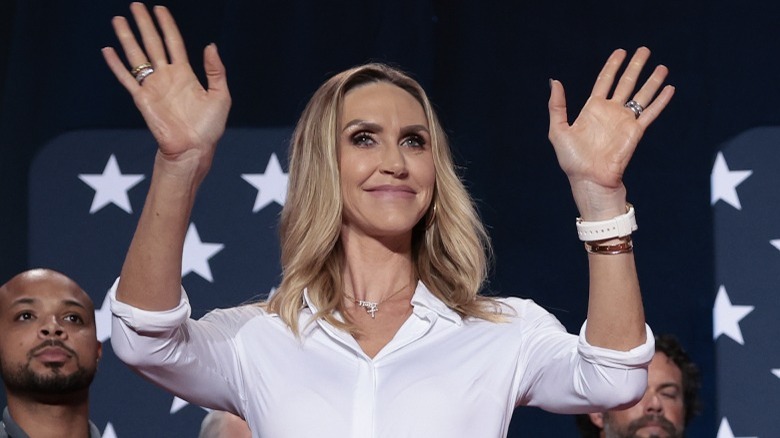 Lara Trump waves on stage after speaking at an event in Fayetteville, NC (2024)