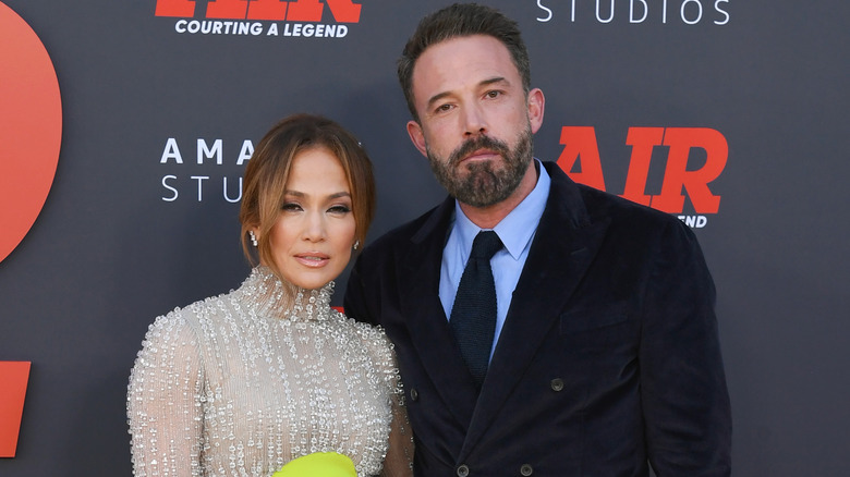 Ben Affleck and Jennifer Lopez pose at an event