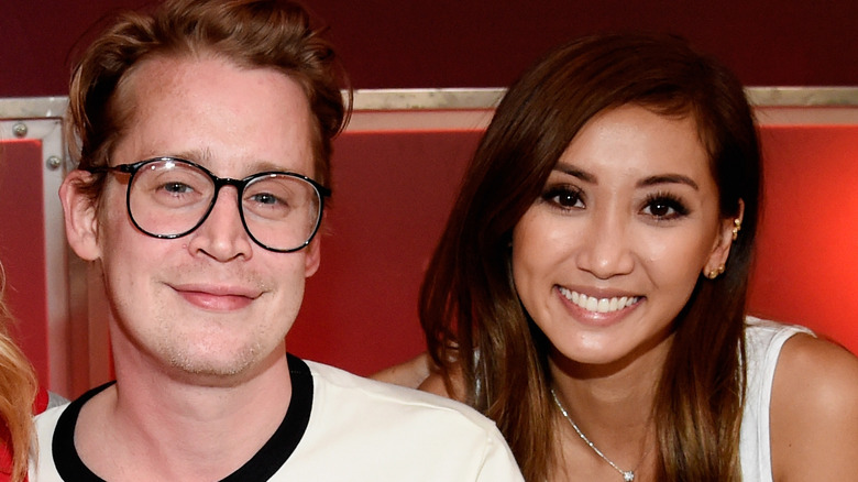 Macaulay Culkin and Brenda Song smiling