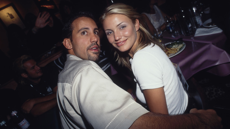 Cameron Diaz and Carlos De La Torre sitting together