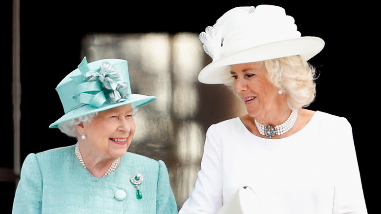 Queen Elizabeth and Camilla Parker-Bowles smiling