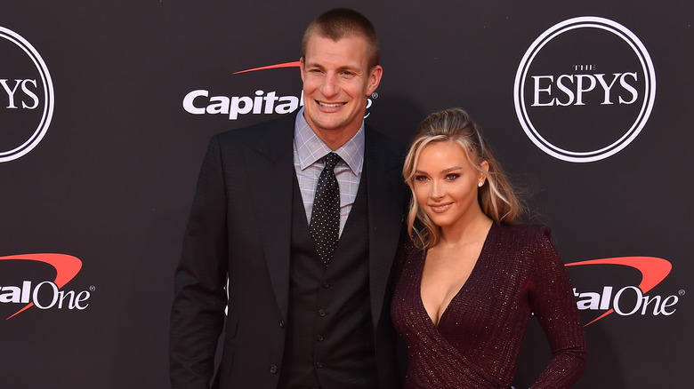 Camille Kostek and Rob Gronkowski pose 