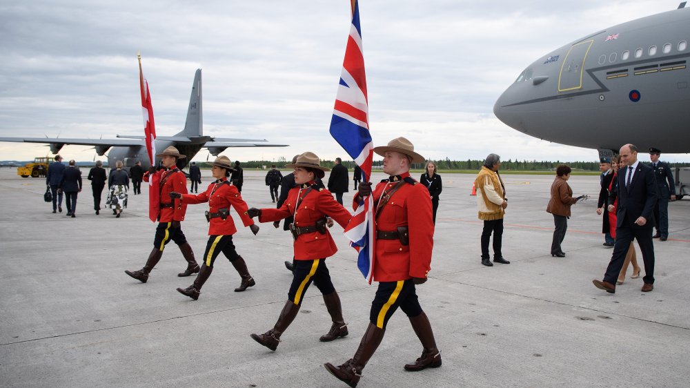 Canadian police officers with Canadian and British flags