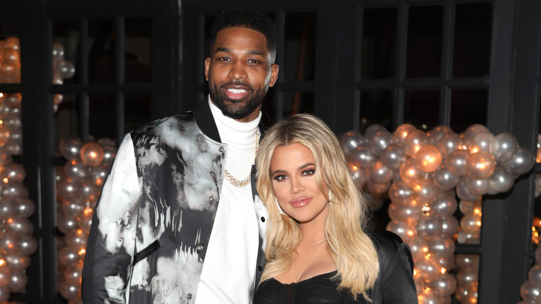 Tristan Thompson and Khloe Kardashian smiling for cameras