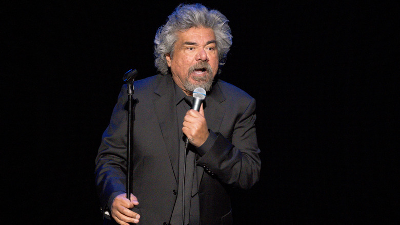 George Lopez holding microphone