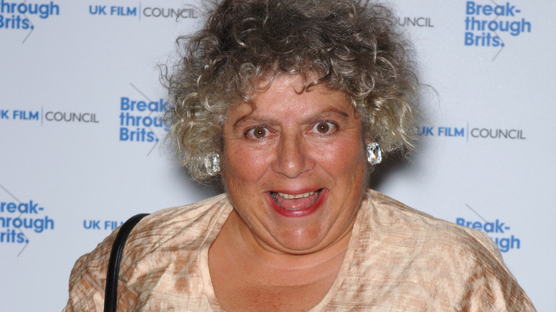 Miriam Margolyes smiles on a red carpet