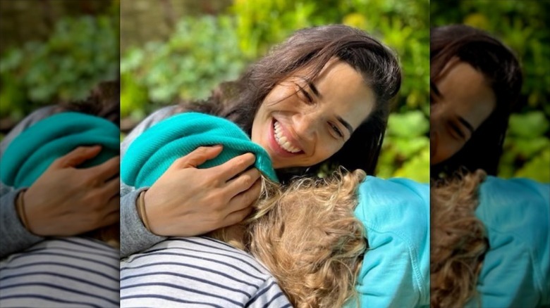 America Ferrera hugs her children