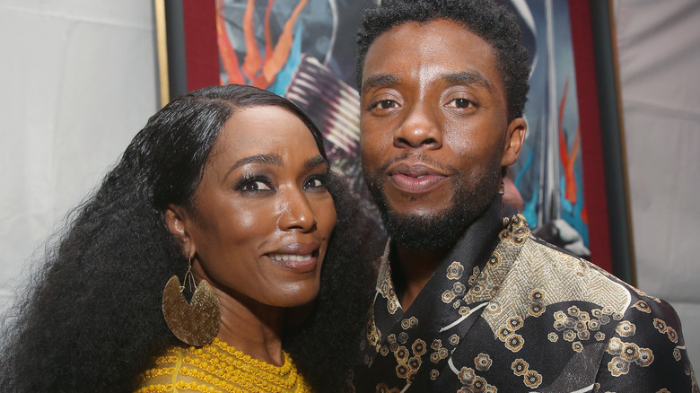 Angela Bassett and Chadwick Boseman smiling 