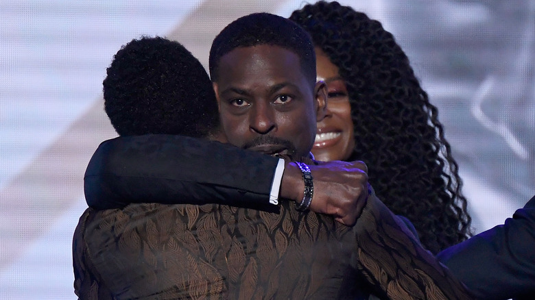 Sterling K. Brown and Chadwick Boseman hugging 